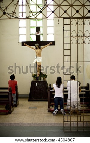 stock-photo-people-praying-picture-taken-inside-cathedral-in-cagayan-de-oro-mindanao-philippines-4504807.jpg