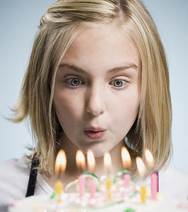 girl-blowing-candles.jpg