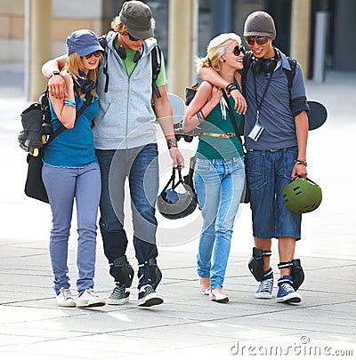 happy-young-couples-walking-together-on-street-thumb5614202.jpg