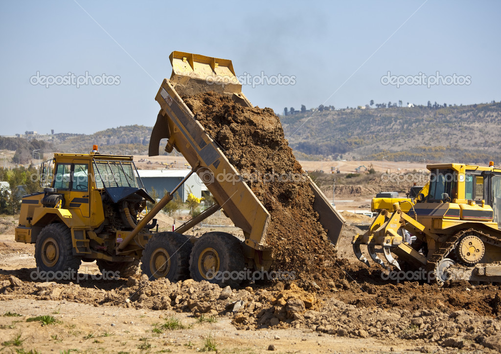 depositphotos_15431347-stock-photo-tip-truck-and-ripper-at.jpg